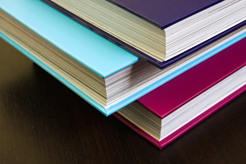 Thick encyclopedias with colorful hardcovers by Horia Varlan